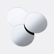 Three white spherical objects with a black band on a white background